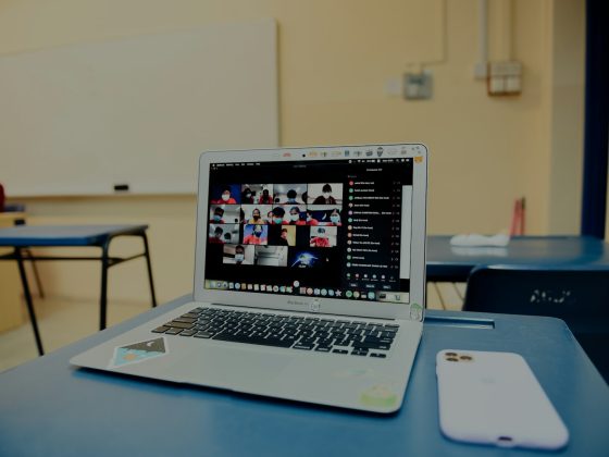 macbook pro on blue table